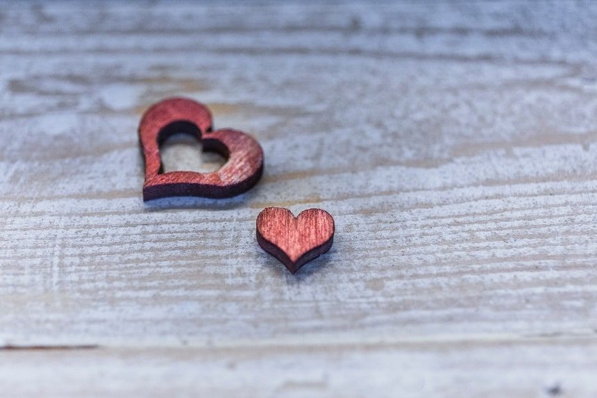 Image, two wooden hearts cut out on a table